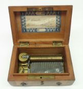 A second half of the 19th Century Swiss Burr Walnut and cross banded Music Box, 8411, the