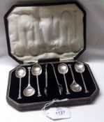 A cased set of six George V seal end Coffee Spoons together with the matching Sugar Tongs, Sheffield