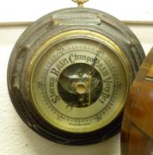 A small early 20th Century Oak cased circular Aneroid Barometer, with Brass bezel, 6 ½” diam