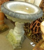 A large 19th Century Marble pedestal Urn, the round top to a carved pedestal decorated with