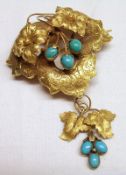 An Antique Gold heart shaped open work Brooch with articulated leaf mounts and set with three