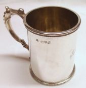 A George V Christening Tankard of cylindrical form, beaded rim and foot rim, beaded double “C”