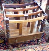 A Victorian Mahogany and Rosewood Canterbury, the top with three sub-divided sections, with turned