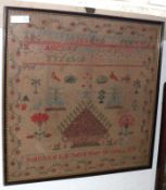 A framed coloured Needlework Sampler, decorated with rows of text and floral motifs, signed “