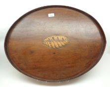 A late 19th Century Mahogany inlaid oval Tray with raised surround, 25” wide.