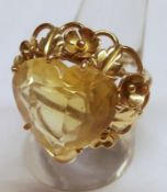 A unmarked yellow metal designer made Dress Ring feature a large facetted heart shaped Citrine