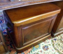 A Victorian Mahogany Box Commode with flip-top lid and folding arm rests, fitted with a white