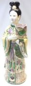 A large 20th Century Chinese Figure of a Young Girl in traditional costume clutching a Jardinière,