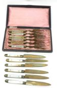 A Boxed set of six small Mother of Pearl handled base metal Forks and six matching Knives