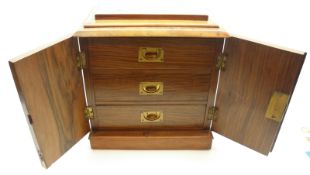 A small late 19th Century Walnut veneered Table top Cabinet, doors open to reveal three small