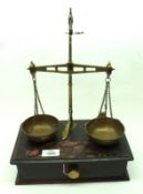 A set of Vintage Brass Beam Scales, on a stained Treen base with central drawer, together with a