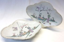 A pair of oval Dishes, each painted in famille verte, mauve and famille rose, etc with figures in