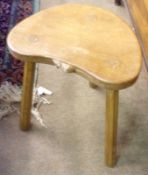 A Mouseman Oak three legged Stool, circa third quarter 20th Century, carved small mouse to front,