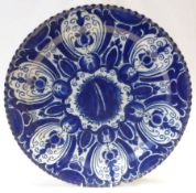 A European circular Dish with crimped rim, decorated in under glazed blue in the Delft manner with