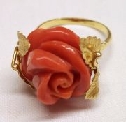 An unusual high grade yellow metal carved Red Coral, rose design Ring with engraved leaf