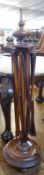 A Victorian Mahogany Pedestal String-Winder, of circular form and raised on balustered peg feet, 29”