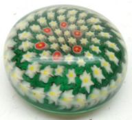 A 20th Century Paperweight with radiating foliate design on a predominantly green ground, 3 ¾”