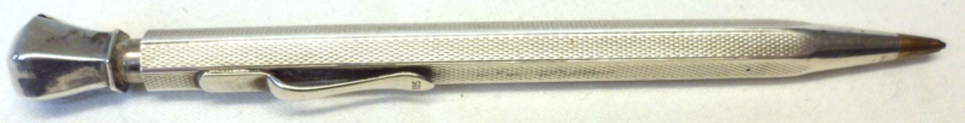 A mid-20th Century white metal encased Propelling Pencil, with engine turned panels, the clip