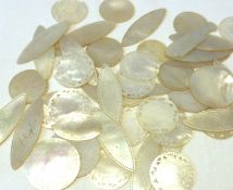 A packet of nineteen elliptical 24 circular and 1 fish shaped Oriental Mother of Pearl Gaming