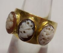 An antique 18ct Gold Ring with three cameo inset panels to the front (cameo is worn), stamped “