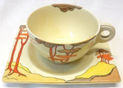 A Clarice Cliff Biarritz Cup and Saucer, decorated with the “Coral Firs” pattern (shoulder pattern