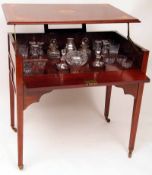 An unusual Edwardian Metamorphic Drinks Cabinet of rectangular form, the inlaid top lifts to