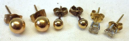 A pair of hallmarked 18ct small Diamond stud Earrings and two further pairs of yellow metal ball