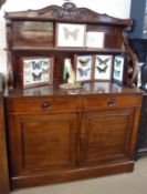A Victorian Mahogany Chiffonier, the base with two doors and drawers, with central turned knob