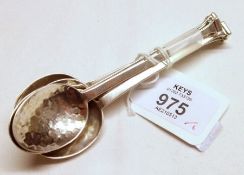 A set of six George V Coffee Spoons in Arts & Crafts style, having spot-hammered bowls and plain