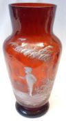 A Cranberry Glass Vase, painted in the manner of Mary Gregory with a motif of a child standing in