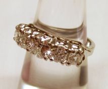 An unmarked precious metal five graduated brilliant cut Diamond Ring of approximately 1.2ct total.