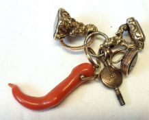 An antique group of three various Fobs, Watch Winding Key and Stag Coral Pendant.