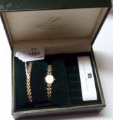 A Ladies cased 9ct Gold Sovereign Wristwatch with integral 9ct gold Bracelet, together with a
