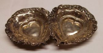 A small pair of Edwardian embossed heart shaped Bon-Bon Dishes with scrolled edges and pierced