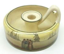 A Doulton Series Ware squat handled Chamber Stick, decorated with figures and windmills, (cracked