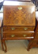 A good quality reproduction Walnut veneered Queen Anne style Ladies Writing Bureau, the fall opening