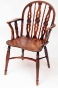 A 19th Century Mendelsham type Yew and Elm Windsor Chair, the back and arms with pierced splats with