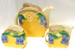 A Clarice Cliff Stamford Tea Set, decorated with the “Canterbury Bells” pattern on a Café au Lait