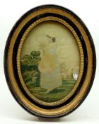 A 19th Century oval Needlework Picture on Silk back, depicting a young woman holding a sheaf of