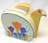 A Clarice Cliff Stamford Tea Pot, decorated with the “Crocus” design, 5” high.