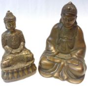 Two Oriental gilt metal Models of seated Deities, each in the Lotus position with joined hands, 6 ¾”