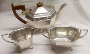 An Edward VIII three piece Tea Set of elongated octagonal design, each item supported on four paw