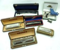 A collection of assorted Harmonicas, to include: M. Hohner’s Chromatische Bass Harmonika in fitted