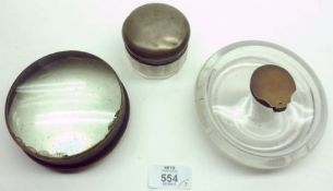 A large circular Glass Inkwell of compressed form; a further Table Top Magnifier and a base metal
