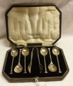 A cased set of six George V seal end Coffee Spoons together with the matching Sugar Tongs, Sheffield