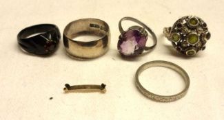 A Mixed Lot comprising: an engraved Platinum Wedding Ring weighing approximately 3gm; together