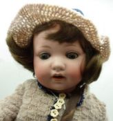 Armand Marseille Bisque Head Child Character Doll with blue weighted sleep glass eyes, attached