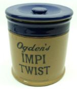 A Vintage Stoneware “Ogden’s Impi Twist” Covered Jar of circular form (hairline crack), 6 ¾” high