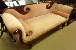An early 19th Century Mahogany Sofa with fan-moulded scrolled back and scrolled arms over a torus
