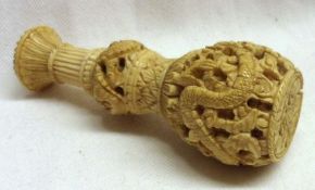 A late 19th Century Oriental Carved Ivory Hand Seal, the baluster handle decorated throughout with